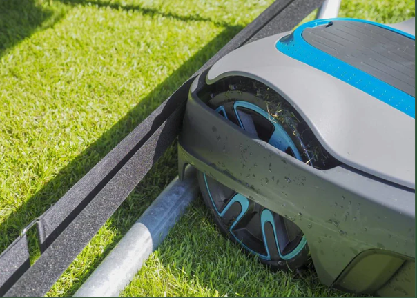Garden trampoline equipped with Robostop guards to prevent mower incidents.
